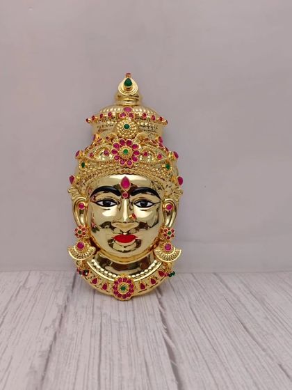A fully gold-plated Lakshmi face, shining with divine radiance. This Mukhwada is for those who want a completely golden look for the goddess.