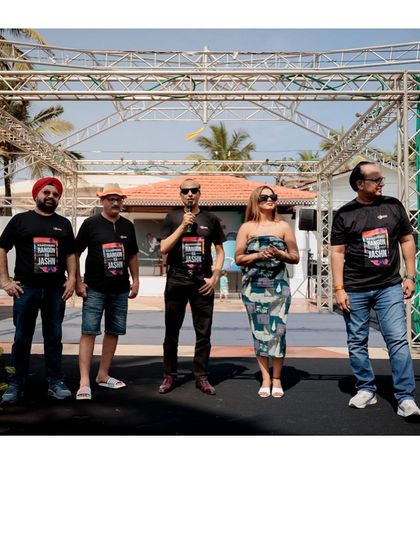 On stage with the team leaders, kicking off a day of fun and bonding activities.