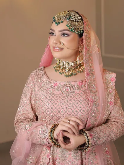 Another portrait of the beautiful Anand Karaj bride, showcasing her soft makeup and elegant, clean hairstyle.