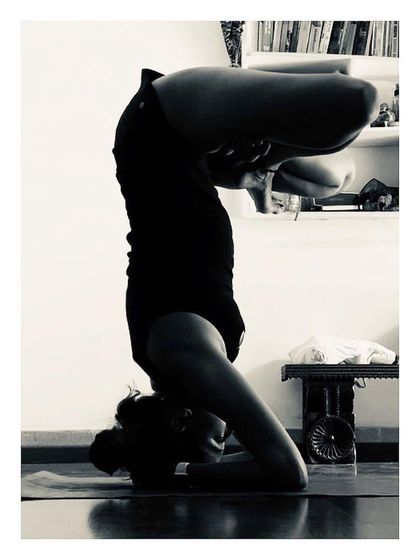 This is a variation of Sirsasana, or Headstand. Inversions are a core part of our advanced practice, helping to build upper body strength, improve circulation, and calm the nervous system.