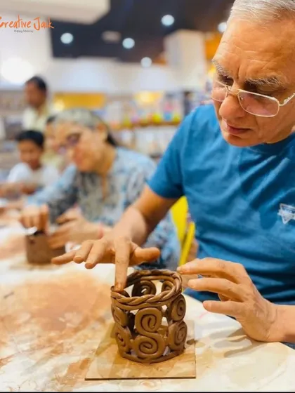It's never too late to learn something new. Here, a student is completely focused, shaping a beautiful woven basket during one of my hands-on pottery sessions.