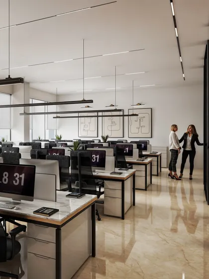 Another view of the open office, showing the clean lines of the desks and the ample natural light from the large windows.