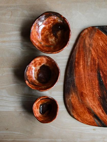 A close up of the small, organic dip bowls that accompany the festive platter, each with its own unique swirl of color.