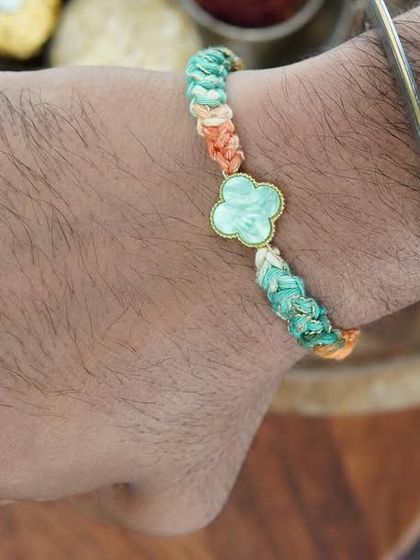 My Clover Rakhi being worn. The four-leaf clover charm is for good luck!