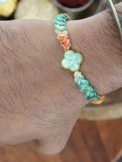 My Clover Rakhi being worn. The four-leaf clover charm is for good luck!