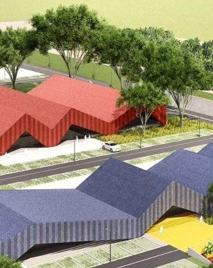 An aerial view of the unbuilt project, showing how the different colored, zigzagging roof forms create a playful and cohesive masterplan.