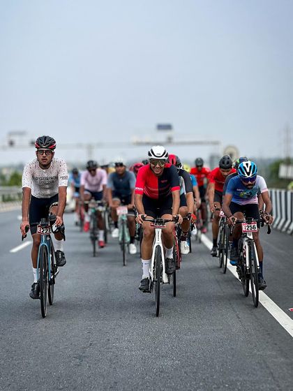 An elite rider, leading the peloton in a long and grueling race.