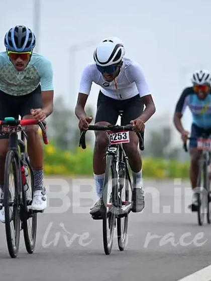 A breakaway of three riders works hard to maintain their gap from the main field.