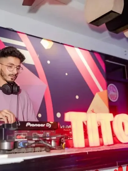 A calm moment behind the decks at Tito's before the night kicks into high gear. The setup is ready for a long night of music.