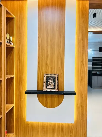 A different angle of the wooden partition, showing the built-in shelving for trophies and decor. The integrated lighting adds a warm glow and highlights the displayed items.