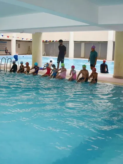 My classes are structured and organized. Students line up by the pool for instructions before starting their drills for the day.