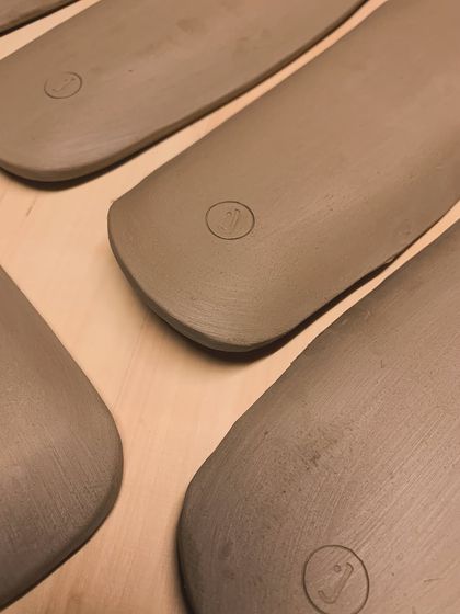 Raw, unglazed serving platters, stamped and ready for the kiln. I love the smooth, clean lines of these pieces before they are glazed.