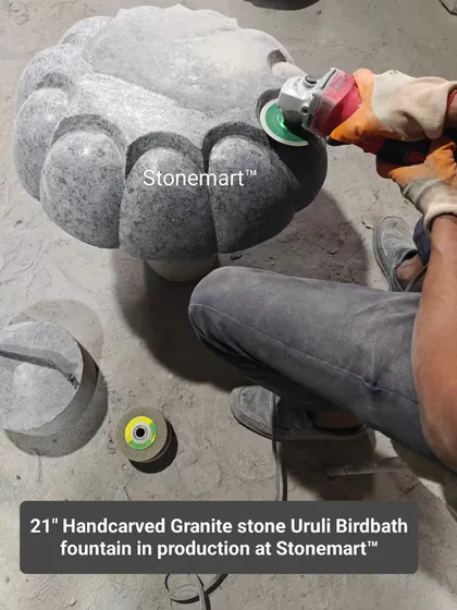 This image shows the manufacturing process of our 21-inch hand-carved granite stone urli birdbath fountain. The intricate details are shaped by our skilled craftsmen.