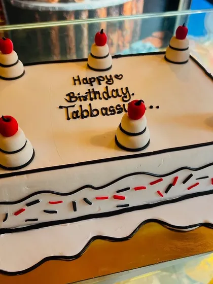 A trendy comic or vector-style cake, where black outlines create a cool 2D cartoon effect on a 3D cake.