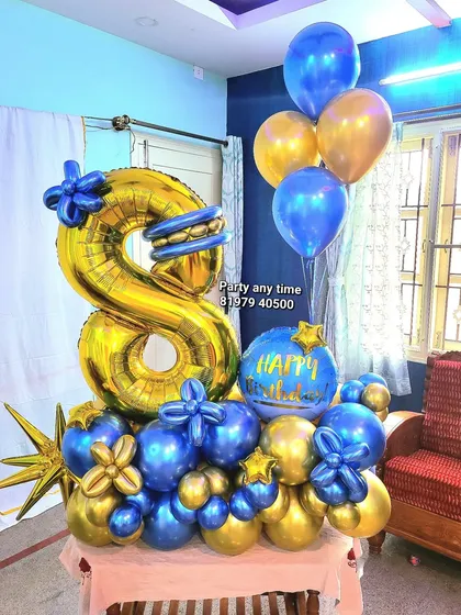 An 8th birthday number bouquet in blue and gold chrome.