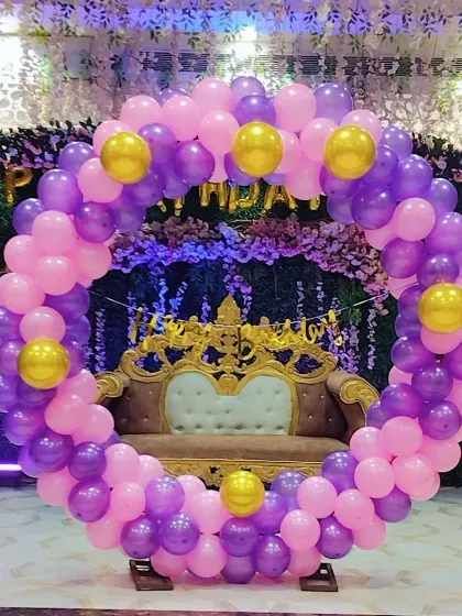 Another view of the purple and pink ring backdrop, ready for a birthday celebration.