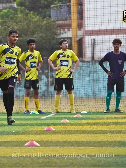 Players listen intently and observe as they wait for the next drill to begin.