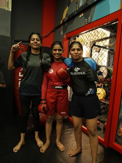 Three of our women warriors, standing together after a training session. They are strong, fierce, and unstoppable.