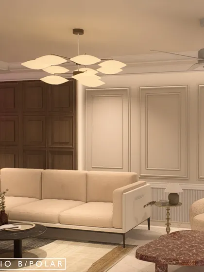 The living area of the same villa features rich wood paneling and a mix of modern and classic furniture. The design creates a warm, sophisticated atmosphere that feels both grand and inviting.