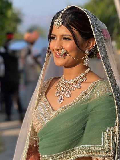 Captured in the golden hour light, this bride is absolutely glowing. The soft makeup look is perfect for an outdoor, daytime ceremony.