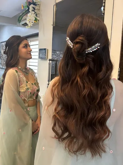 A mirror selfie showing the half-up style from the front and back simultaneously. It's a great way to see the full effect of the hairstyle.