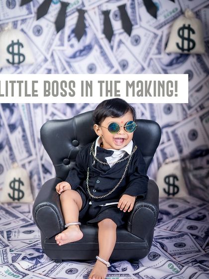 A little boss in the making. This money-themed photoshoot is full of wealth and charm, with a confident little CEO who is clearly in charge.