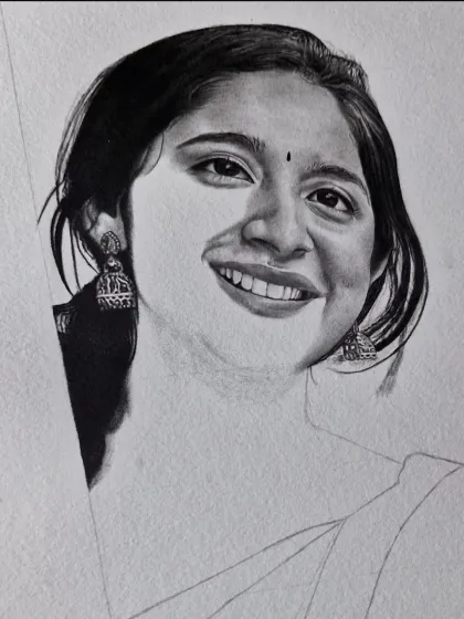 A work-in-progress shot of a portrait. You can see how I build up the dark, rich tones of the hair and eyes layer by layer.