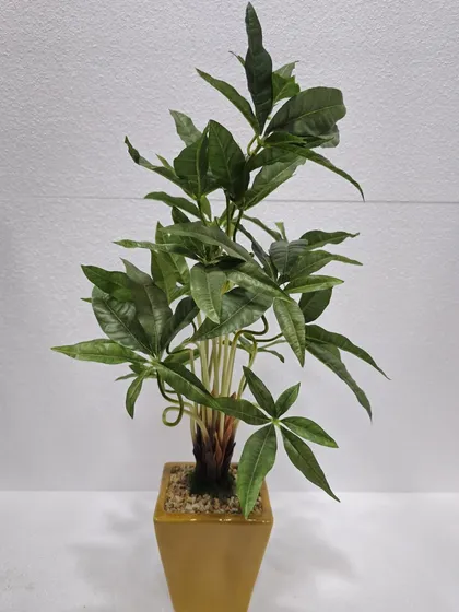 An artificial Pachira Aquatica (Money Tree) plant in a simple pot, known for its distinctive five-leaf stems.