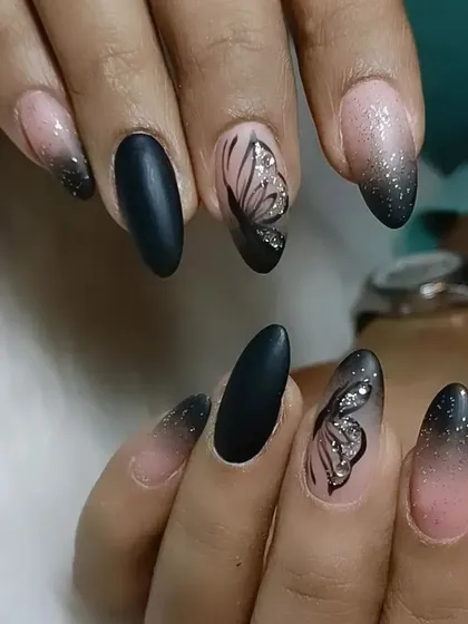 Bring us your inspiration and we will bring it to life. This set features a mix of matte black, a glittery black-to-nude ombre, and delicate butterfly wing art.