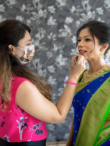 A shot of me in action, giving the final touches to a bride's lip color before her ceremony.