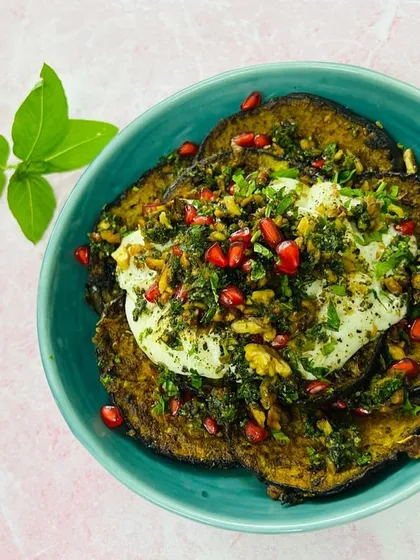 Our Aubergine and Burrata Salad with a walnut relish is a celebration of textures and flavors, combining smoky grilled eggplant with creamy cheese and a crunchy, savory topping.