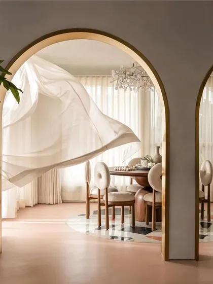 This iconic shot of the billowing curtain in the "Marshmallow" dining room was featured by FOAID, capturing the home's breezy, elegant spirit.
