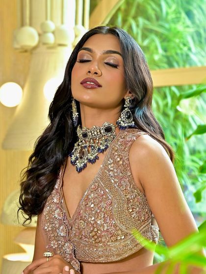 A close-up showing the detail of the eye makeup. A soft smoky eye with a hint of shimmer adds drama and sophistication to this reception look.