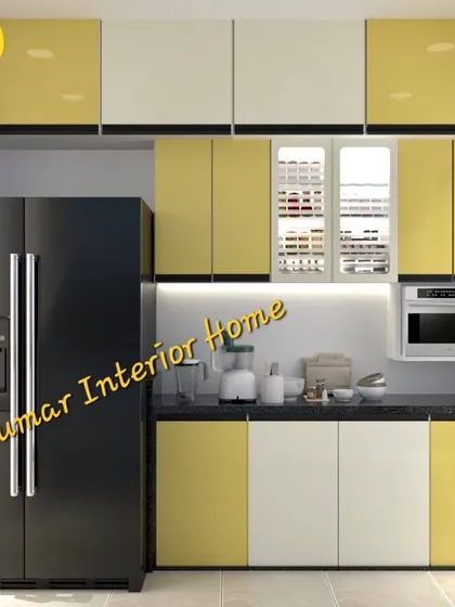 A two-tone modular kitchen in yellow and white high-gloss laminate. The design includes a dedicated space for a large refrigerator and a built-in microwave, showcasing our expertise in appliance integration.