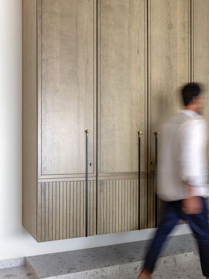 A wardrobe that defies gravity and convention. This floating wardrobe in a Mumbai apartment adds a touch of whimsy and wonder to the everyday routine, perfectly blending style and functionality.