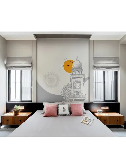 The bedroom is a calm and balanced space, with a custom mural, simple furniture, and large windows dressed with roman blinds.