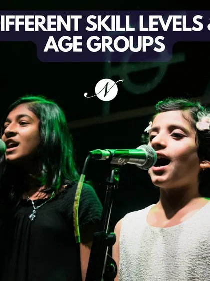 We welcome singers of all ages and skill levels. This photo shows two of our young vocal students performing together, highlighting the community and confidence we build.