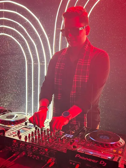 The red lighting adds to the intense atmosphere of the party. I work with lighting technicians to create a complete sensory experience.