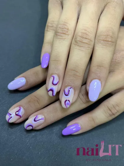 The full set of the purple swirl nails, showing how the abstract patterns create a cohesive and artistic look across both hands.
