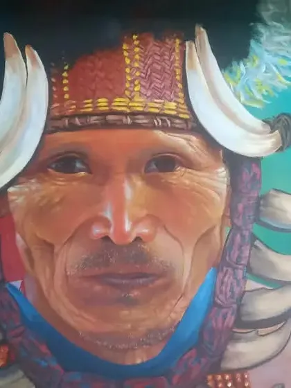 This realistic portrait of a tribal elder is an example of my focus on cultural narratives and ancestral memory. Executed on a university wall, the piece captures the subject's dignity and connection to heritage, using acrylics to achieve depth and lifelike detail.