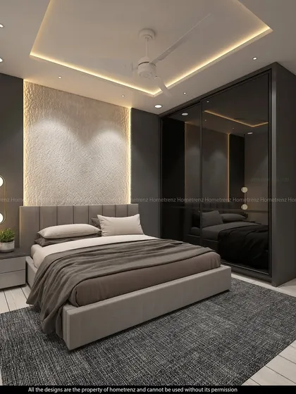 This view highlights the dark, reflective wardrobe and the modern pendant lights that add a touch of sophistication to the guest bedroom.