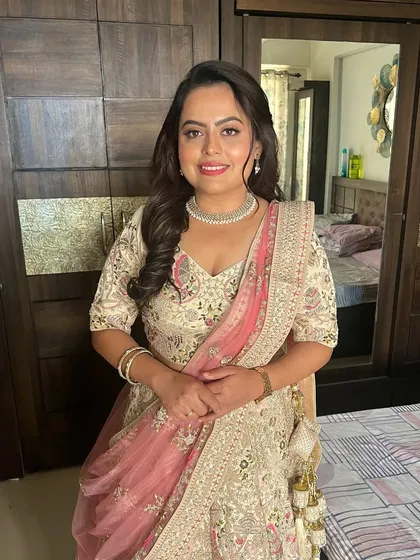 A happy and confident smile from the bride-to-be. The dewy makeup look enhances her natural radiance, making her glow from within.