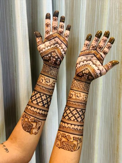 This design features repeating elephant motifs in square blocks, creating a unique and modern look for a traditional symbol.