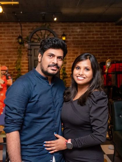 A couple posing for a photo, enjoying the cozy ambiance.