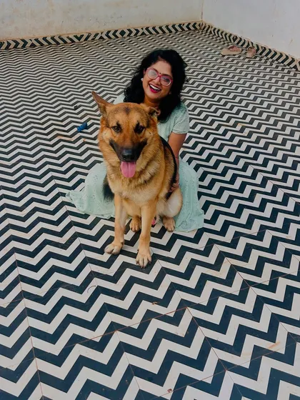 It's all about the bond we build. Sharing a happy moment with a lovely German Shepherd in our clean, open play area. I ensure every dog gets personal attention and feels like part of the family.
