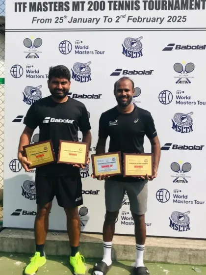Standing with my doubles partner after a successful ITF Master 200 tournament in Kalina. I secured the doubles title and finished as the singles runner-up.