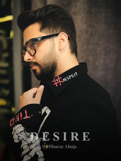 It's all about the mindset. This close-up shows the custom 'Respect' and 'Billionaire Loading' embroidery on the collar, a small detail with a powerful message.