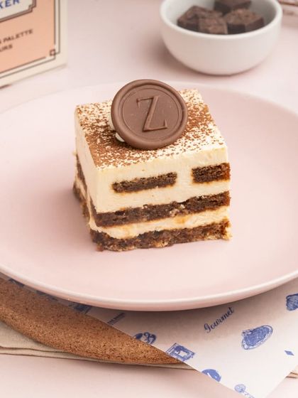 A slice of my classic Tiramisu, a perfect pick-me-up dessert that balances the bitterness of coffee with the sweetness of mascarpone cream.