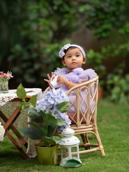 A little tea party for one! This outdoor sitter session setup is perfect for a curious toddler exploring new things.
