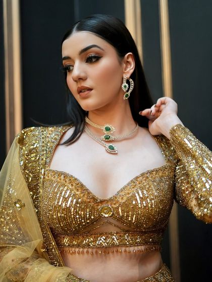 A close-up of the model's makeup. The bold smoky eye is balanced with a nude lip, and her skin is glowing.